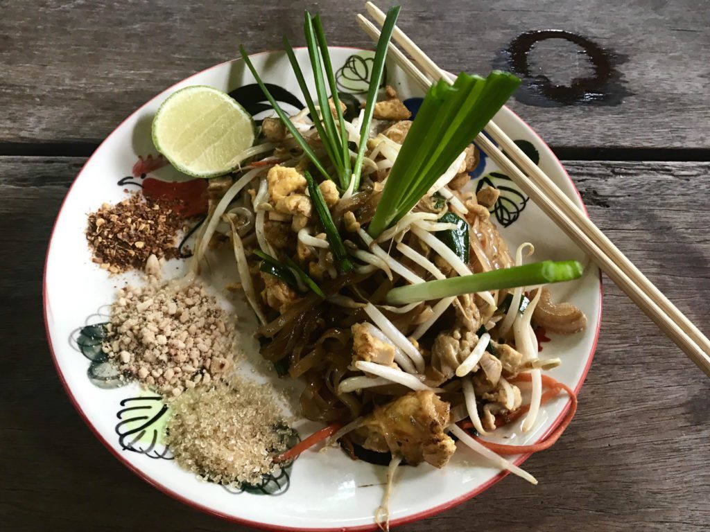 A plate of Pad Thai with chopsticks