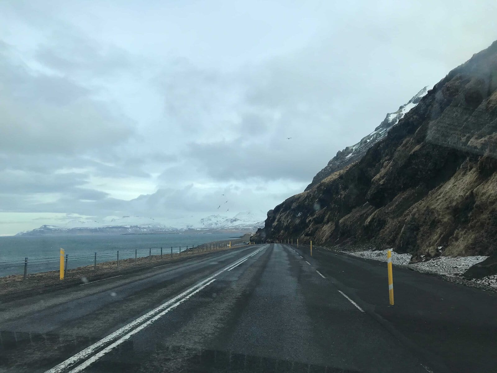 Road between the ocean and mountains in the Snæfellsnes Peninsula in Iceland.