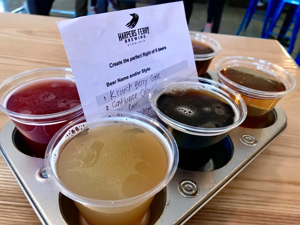 Flight of beer with a card that says "Harpers Ferry Brewing"