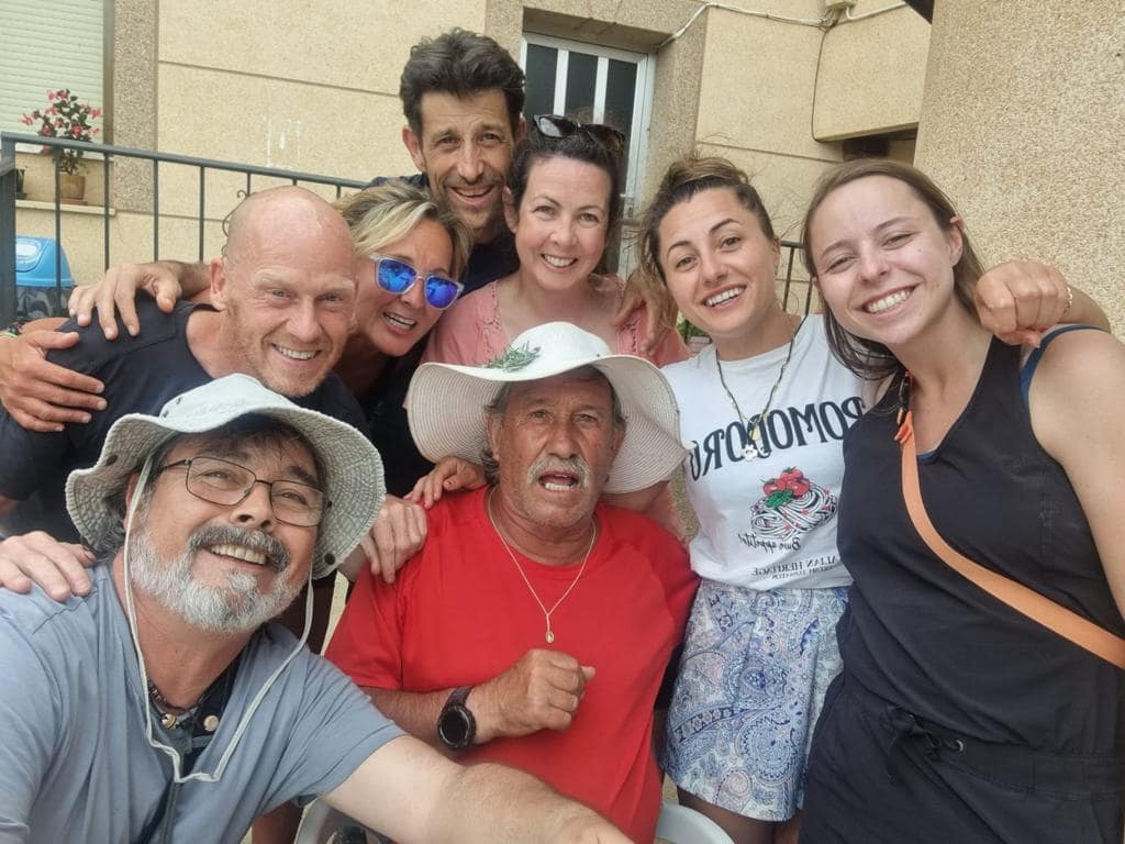 Group of people smiling on the Camino de Santiago