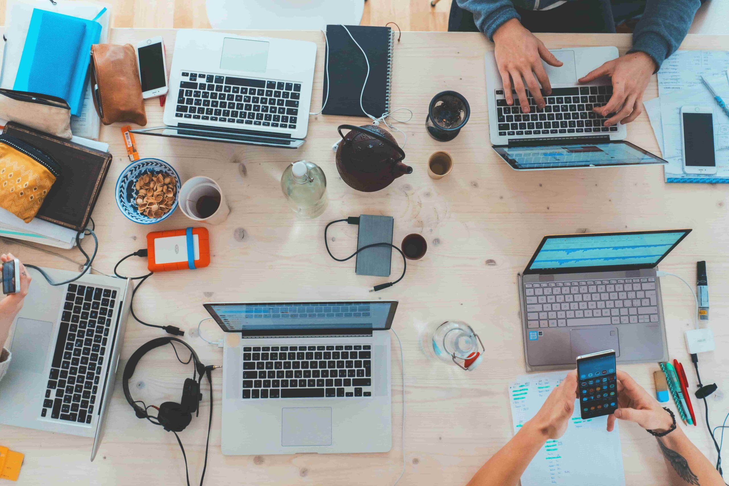 View of people working on laptops from above