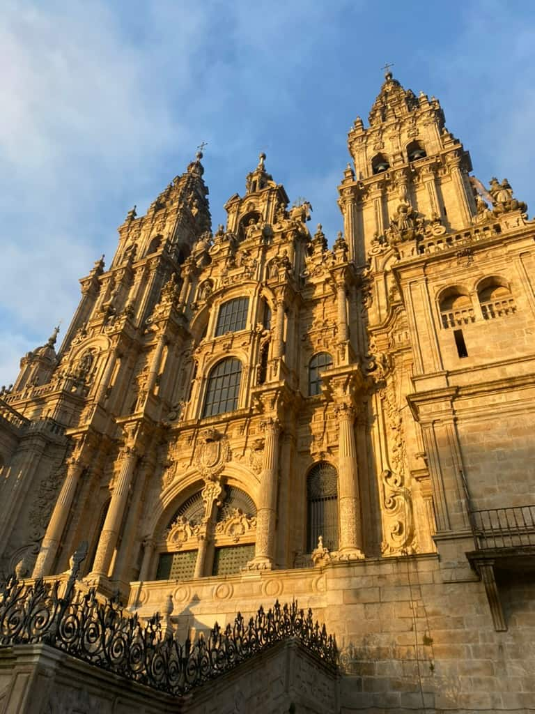 The cathedral in Santiago de Compostela illuminated in golden light by the setting sun