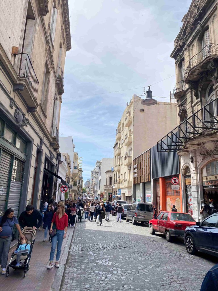 San Telmo Market in Buenos Aires with a packed street full of people as far as you can see