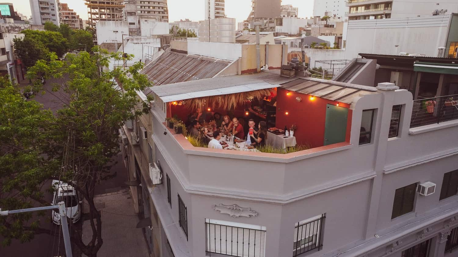 Birdseye view of people enjoying the asado experience in Buenos Aires on a rooftop