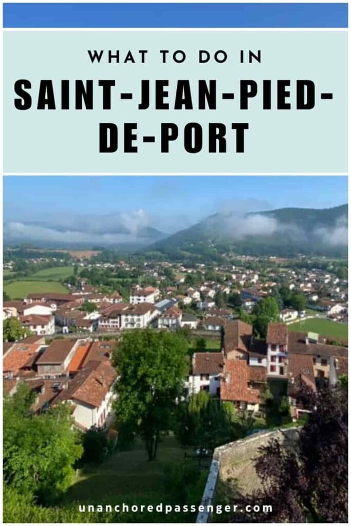 Saint-Jean-Pied-de-Port from above with mountains in the distance and text that says, "What to Do in Saint-Jean-Pied-de-Port"