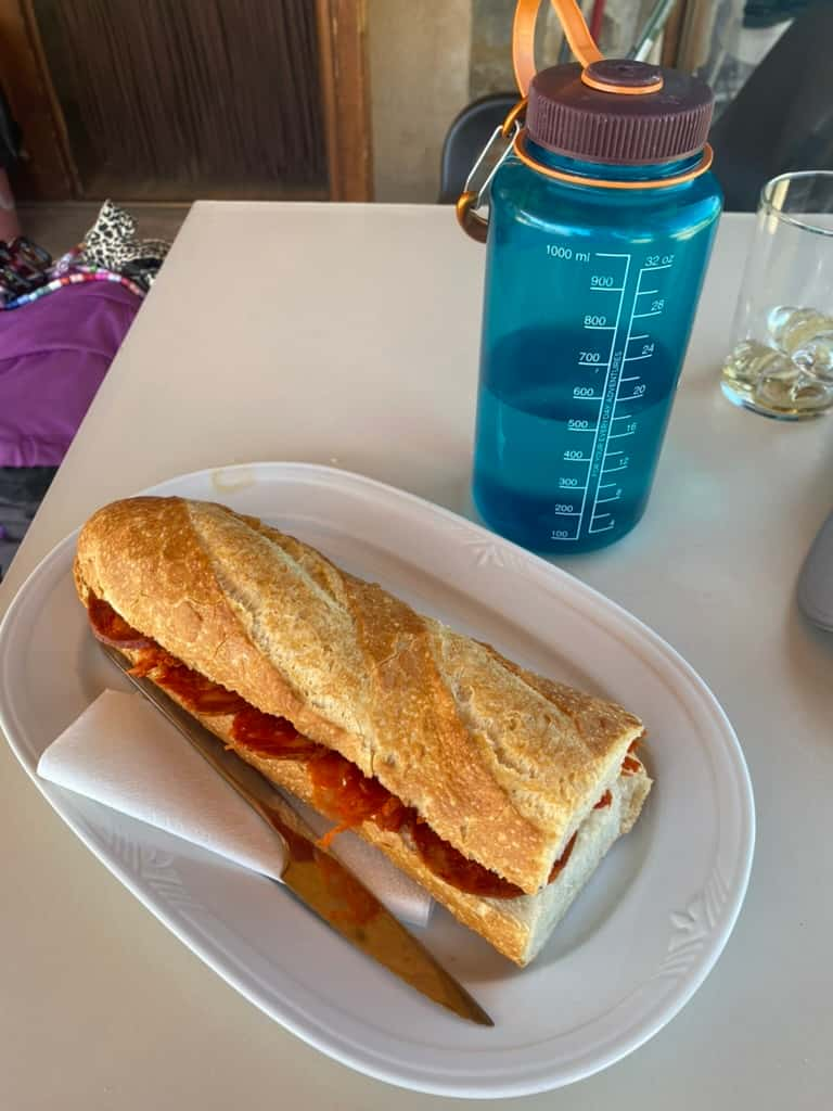 Bocadillo sandwich and a water bottle somewhere along the Camino de Santiago