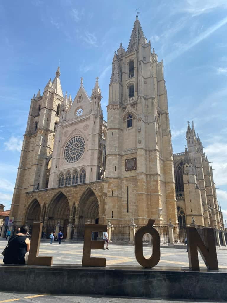 Cathedral in León, Spain and a sign that says "León."